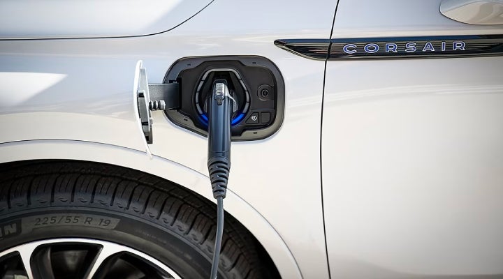 An electric charger is shown plugged into the charging port of a Lincoln Corsair® Grand Touring
model. | Parks Lincoln of Gainesville in Gainesville FL
